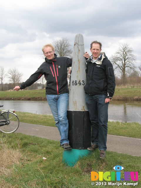 P1011279 Marijn and Pepijn Jenni and Marijn by border marker between Belgium and the Netherlands